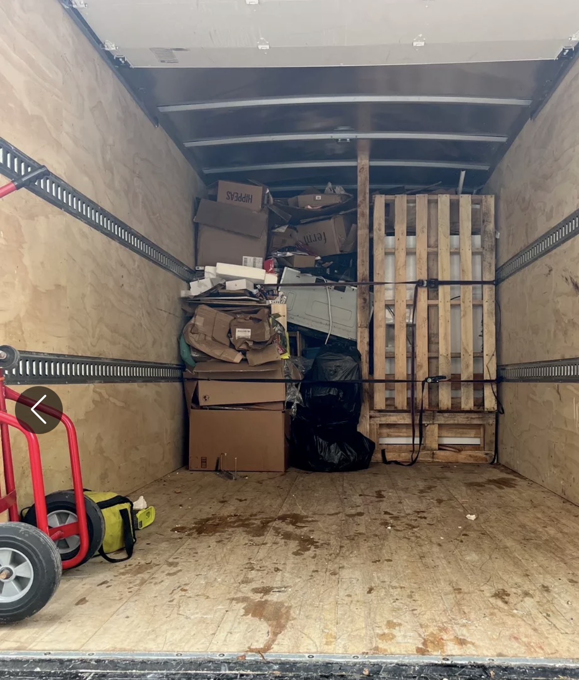 A removal truck loaded and ready to take clutter away
